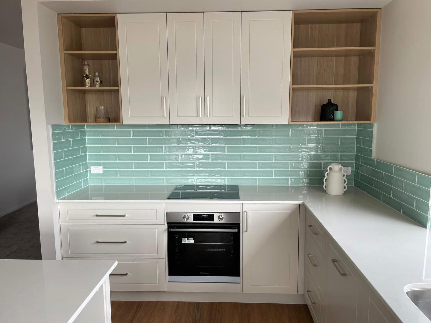 White shaker kitchen with oak open shelving, built by Central Coast Joinery